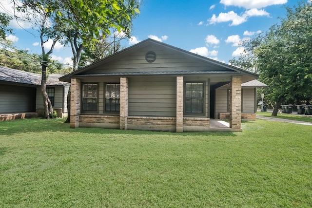1102-1104-1106 Academy St, San Marcos, TX 78666 - rear view of property with a lawn and brick siding