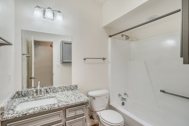 1102-1104-1106 Academy St, San Marcos, TX 78666 - bathroom with toilet, vanity, and shower / bathing tub combination