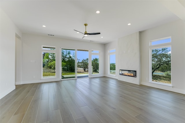 1603 Sapphire, Horseshoe Bay, TX 78657 - unfurnished living room featuring visible vents, recessed lighting, a ceiling fan, and wood finished floors