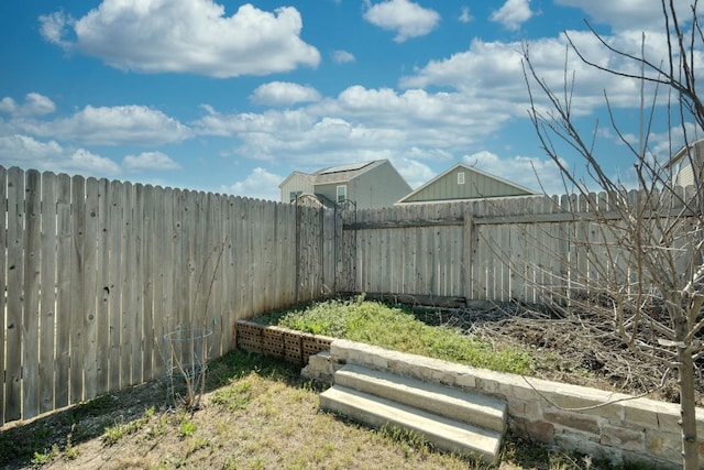 view of yard featuring a fenced backyard