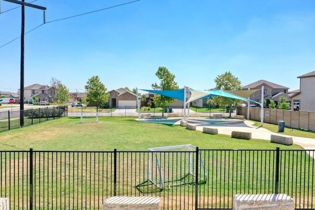 view of yard with a residential view and fence