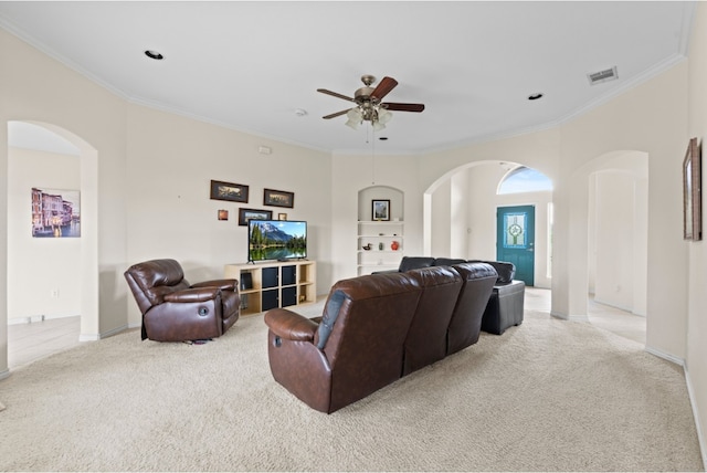 341 Brown Rd, Mcdade, TX 78650 - living room with light carpet, arched walkways, crown molding, and a ceiling fan