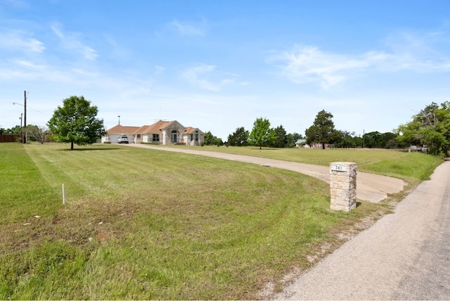 341 Brown Rd, Mcdade, TX 78650 - view of front of house with a front lawn