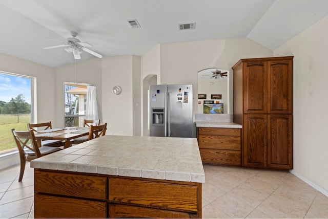 341 Brown Rd, Mcdade, TX 78650 - kitchen featuring visible vents, a ceiling fan, stainless steel refrigerator with ice dispenser, and vaulted ceiling
