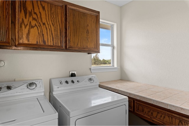 341 Brown Rd, Mcdade, TX 78650 - laundry area featuring washing machine and clothes dryer and cabinet space