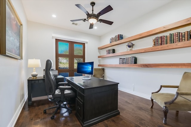 office with a ceiling fan, dark wood-style floors, visible vents, and baseboards