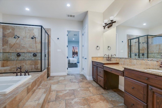 211 Jack Nicklaus Dr, Austin, TX 78738 - bathroom with a stall shower, vanity, ensuite bath, and recessed lighting