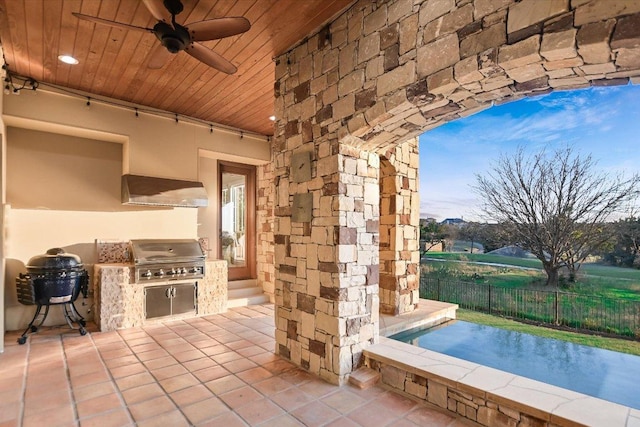 view of patio / terrace with ceiling fan, area for grilling, fence, and a grill