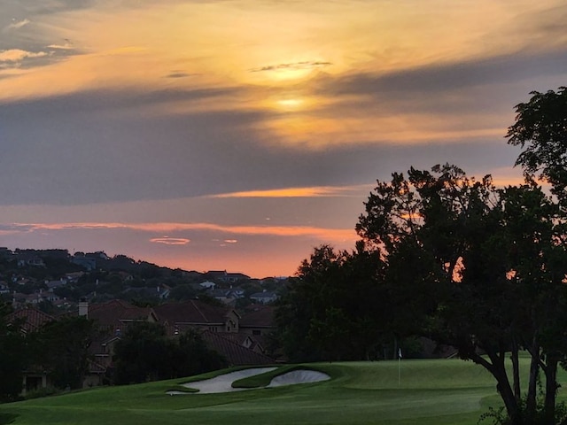 view of property's community featuring view of golf course