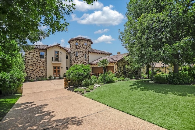 211 Jack Nicklaus Dr, Austin, TX 78738 - mediterranean / spanish-style house featuring stucco siding, a front lawn, a tile roof, and stone siding