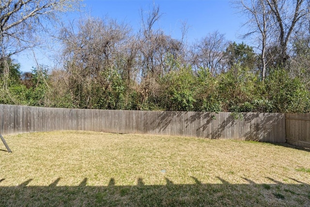 view of yard with a fenced backyard