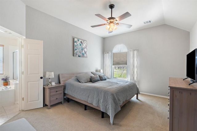 bedroom featuring a ceiling fan, visible vents, baseboards, lofted ceiling, and light colored carpet