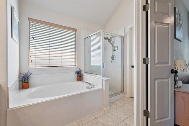 full bath with tile patterned flooring, a stall shower, a bath, and lofted ceiling