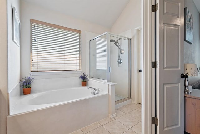 full bath with a shower stall, a garden tub, tile patterned floors, and lofted ceiling