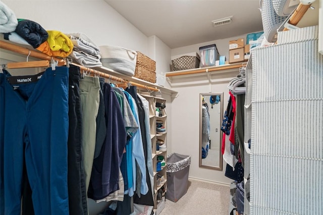 walk in closet featuring carpet and visible vents