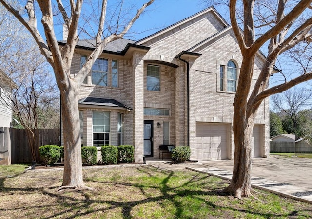 view of front facade featuring concrete driveway, a garage, fence, and brick siding