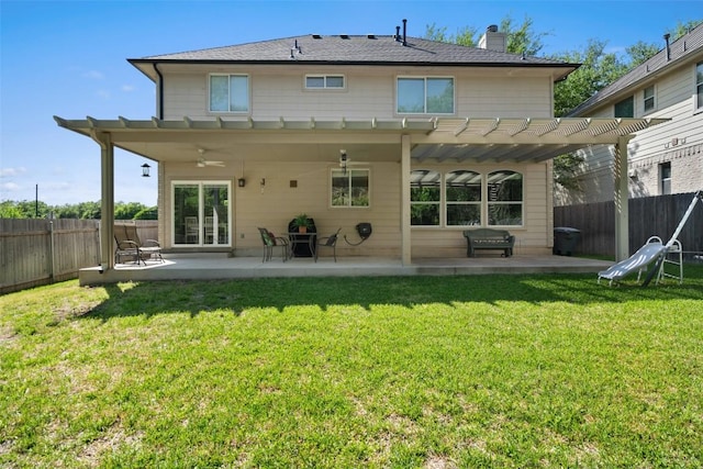 back of property featuring a pergola, a chimney, a patio, a ceiling fan, and a shingled roof