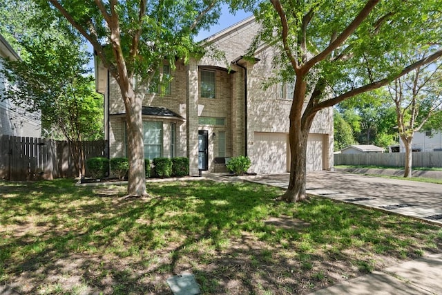 view of front of property with brick siding, driveway, and an attached garage