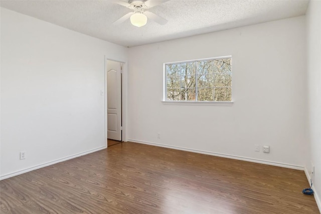 4320 Dos Cabezas Dr, Austin, TX 78749 - spare room with wood finished floors, ceiling fan, baseboards, and a textured ceiling