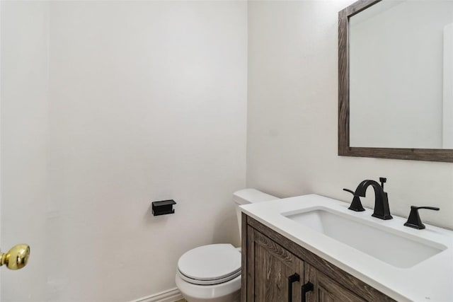 4320 Dos Cabezas Dr, Austin, TX 78749 - half bath featuring vanity, toilet, and baseboards