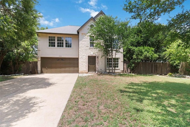 4320 Dos Cabezas Dr, Austin, TX 78749 - view of front facade featuring a garage, stone siding, and driveway