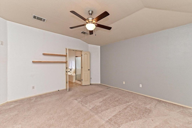 4437 Chickasaw Ct, Austin, TX 78749 - unfurnished bedroom with vaulted ceiling, light colored carpet, a ceiling fan, and ensuite bath