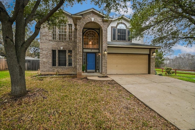 4437 Chickasaw Ct, Austin, TX 78749 - traditional-style home featuring a garage, concrete driveway, and brick siding