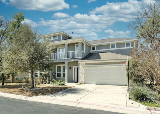 9701 Mcknight Loop, Austin, TX 78717 - view of front of house with an attached garage, concrete driveway, and a balcony