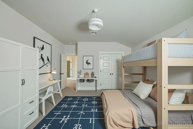9701 Mcknight Loop, Austin, TX 78717 - bedroom featuring a closet, carpet flooring, and vaulted ceiling