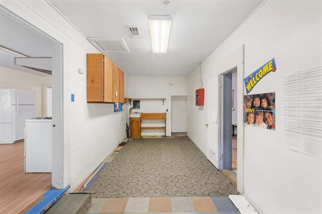 631 S Harris St, Giddings, TX 78942 - hallway with light floors and visible vents