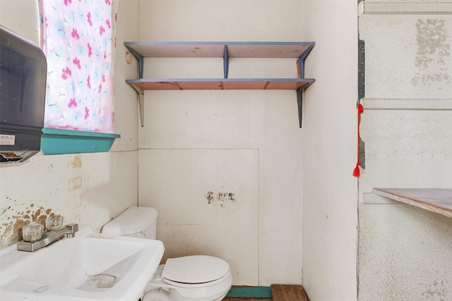 631 S Harris St, Giddings, TX 78942 - bathroom with a sink and toilet