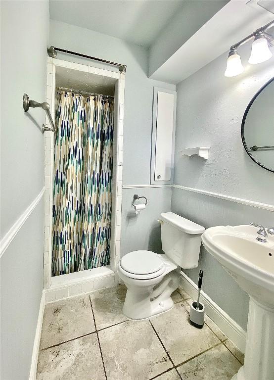 8602 Colonial Dr, Austin, TX 78758 - full bathroom featuring tile patterned floors and a stall shower
