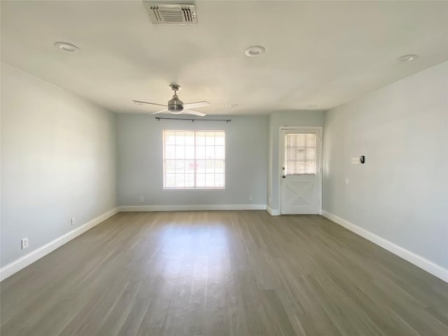 8602 Colonial Dr, Austin, TX 78758 - spare room featuring ceiling fan and wood finished floors