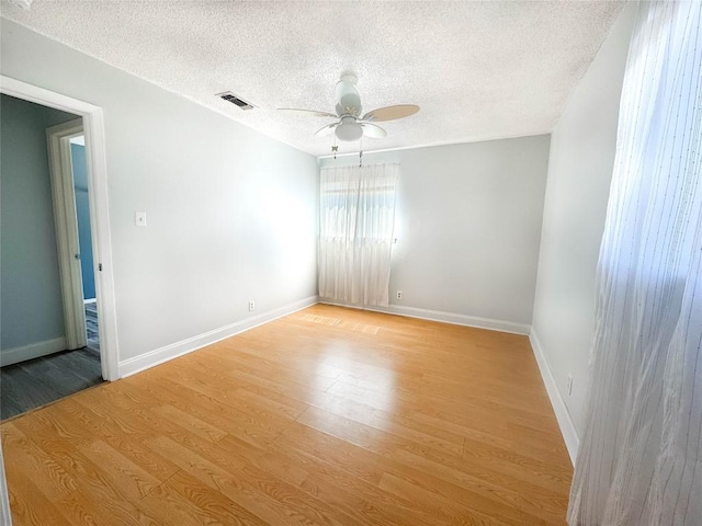 8602 Colonial Dr, Austin, TX 78758 - unfurnished room featuring ceiling fan, light wood-style flooring, a textured ceiling, and baseboards
