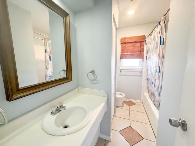 8602 Colonial Dr, Austin, TX 78758 - full bathroom with vanity, toilet, tile patterned floors, and shower / tub combo