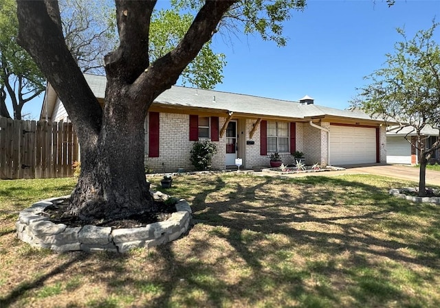 8602 Colonial Dr, Austin, TX 78758 - ranch-style house featuring brick siding, a garage, and driveway
