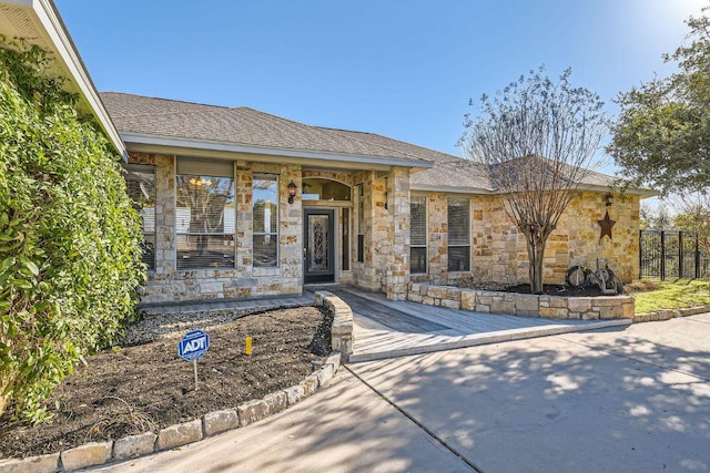 200 Hillside Dr, Dripping Springs, TX 78620 - entrance to property featuring stone siding