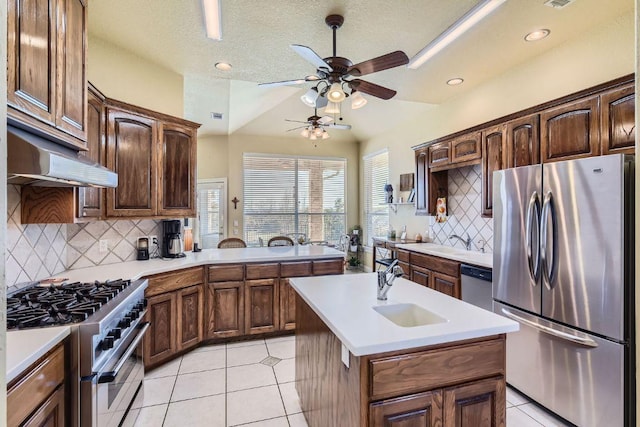 200 Hillside Dr, Dripping Springs, TX 78620 - kitchen featuring stainless steel appliances, ceiling fan, light countertops, light tile patterned floors, and tasteful backsplash