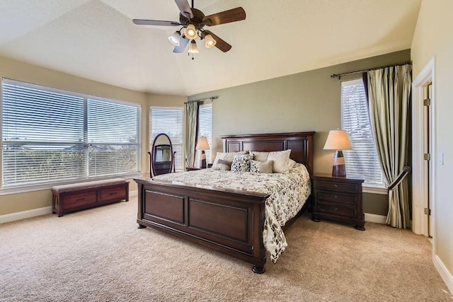 bedroom with multiple windows, ceiling fan, baseboards, and light carpet