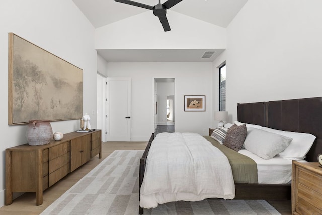 6102 Forest Hills Dr, Austin, TX 78746 - bedroom with high vaulted ceiling, light wood-style floors, and a ceiling fan