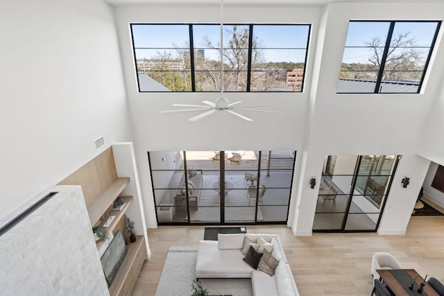 6102 Forest Hills Dr, Austin, TX 78746 - living room with a high ceiling, wood finished floors, and a ceiling fan
