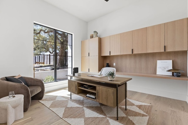 6102 Forest Hills Dr, Austin, TX 78746 - home office featuring light wood-style floors and healthy amount of natural light