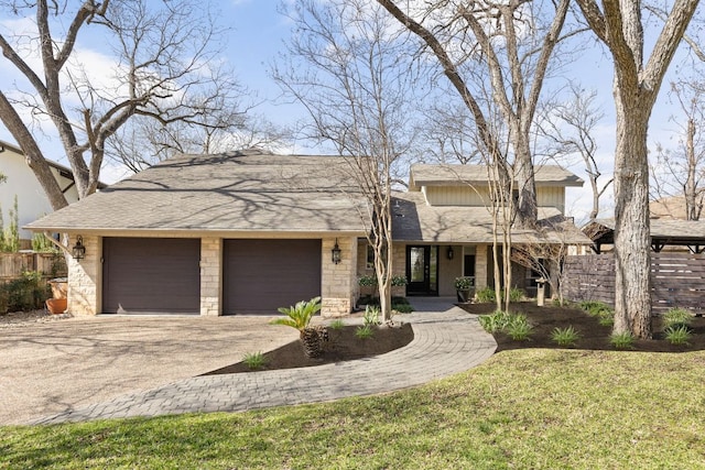6702 Elfland Dr, Austin, TX 78746 - view of front of house with driveway, an attached garage, covered porch, and roof with shingles