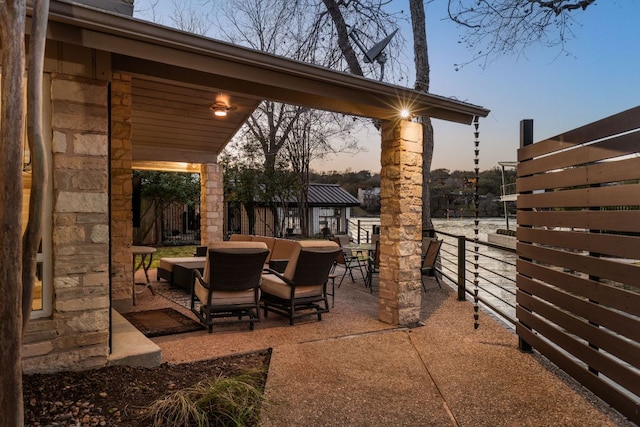 6702 Elfland Dr, Austin, TX 78746 - patio terrace at dusk with outdoor dining area and a patio area
