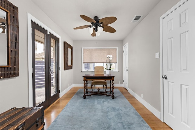 6702 Elfland Dr, Austin, TX 78746 - entrance foyer with french doors, ceiling fan, and wood finished floors