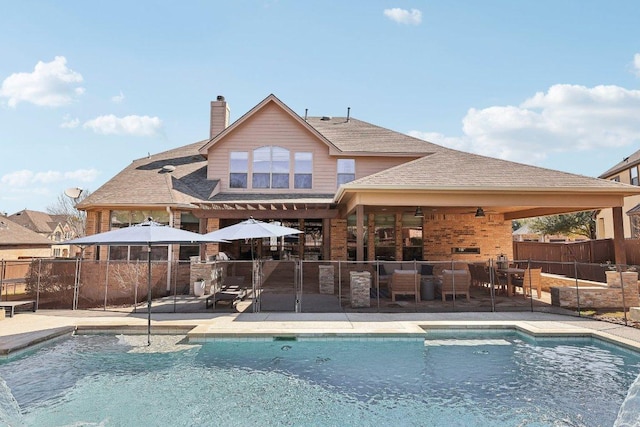 view of swimming pool with an outdoor living space, a fenced in pool, a patio, and fence