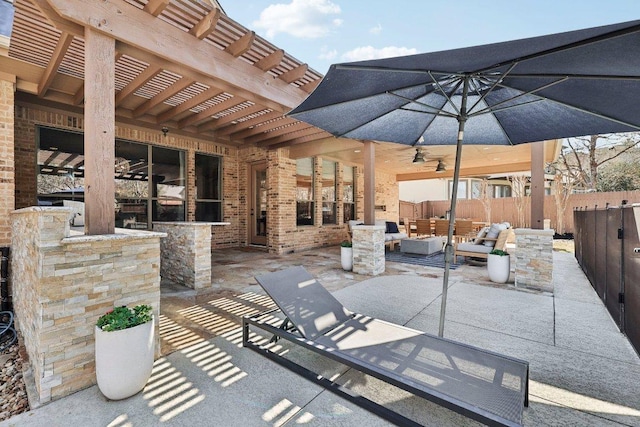 view of patio featuring an outdoor hangout area, a pergola, and fence