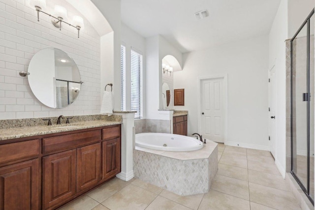full bathroom with tile patterned floors, visible vents, a stall shower, and a sink