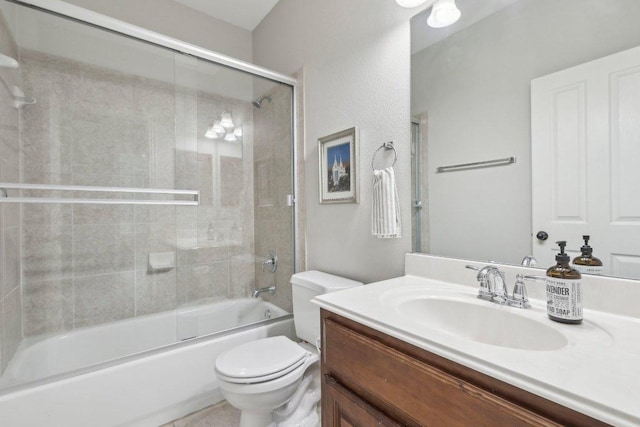 bathroom with vanity, toilet, and enclosed tub / shower combo