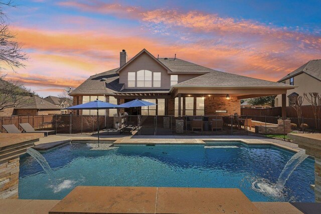 view of swimming pool featuring a patio, a fenced backyard, a fenced in pool, and an outdoor hangout area